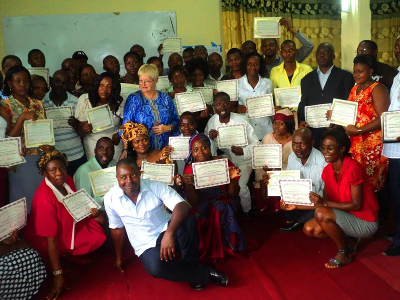 Graduate receiving certificate through AACL-supported training.